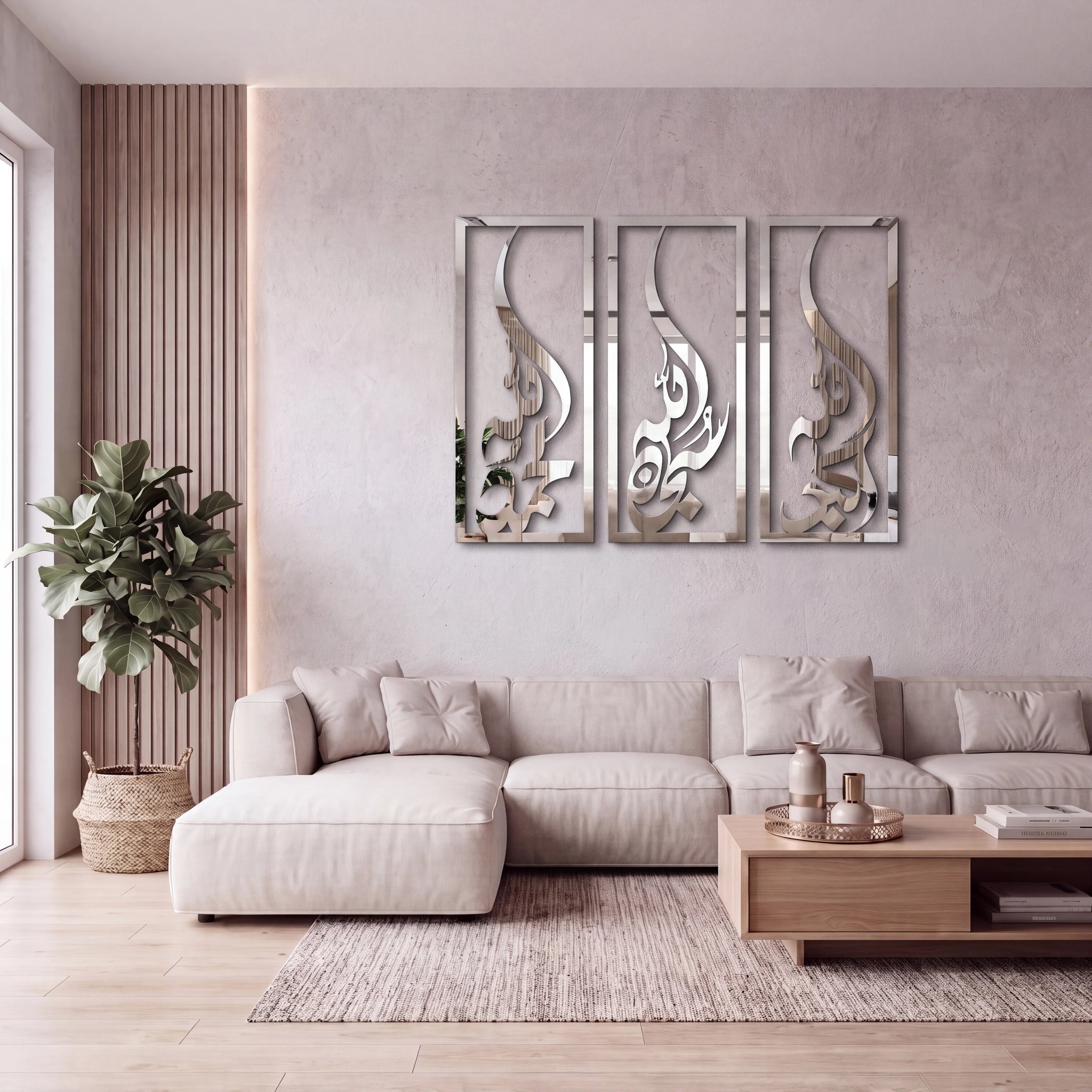 Three-piece Subhanallah Alhamdulillah Allah Ho Akbar Chrome Silver wall art set with metallic silver displayed above a beige sectional sofa in a modern living room setting.