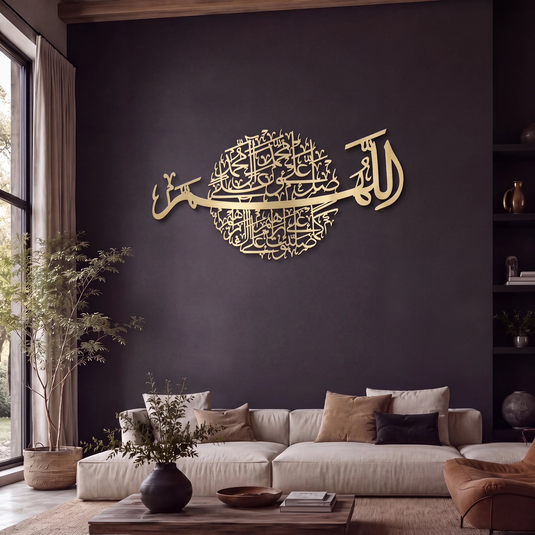 Mate Gold Darood Shareef Islamic wall art featuring Arabic calligraphy of 'Darood Shareef' mounted on a dark charcoal wall above a modern beige sectional sofa in a styled living room.